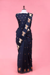 A dark grey Banarasi silk saree with Pichwai border for Navratri, Diwali, Durga Puja, and weddings, displayed on a mannequin.