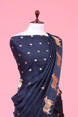 A dark grey Banarasi silk saree with Pichwai border for Navratri, Diwali, Durga Puja, and weddings, displayed on a mannequin.