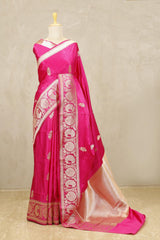 This Rani Pink Banarasi Satin Silk Saree with Peacock Motifs is a wedding saree and festive wear saree. Free Shipping Available!