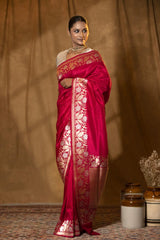 An Indian Woman in Magenta Pink Banarasi Saree with Floral Border