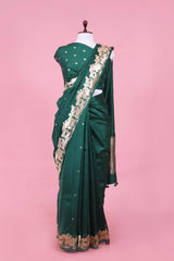 This Bottle Green Handloom Banarasi Saree with Gokul Motifs is a wedding saree and festive wear saree. Free Shipping Available!