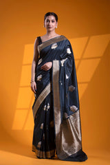 This Charcoal Grey Katan Silk Banarasi Saree with Bastet Motifs is a wedding saree and festive wear saree. Free Shipping Available!