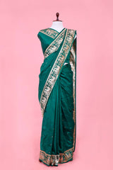 This Bottle Green Banarasi Saree with Rajwada and Nartaki Motifs is a wedding saree and festive wear saree. Free Shipping Available!