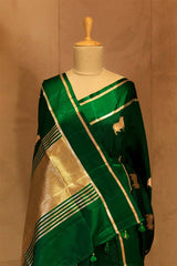 Meenakshi Chaudhary in Bottle Green Banarasi Saree