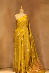 This Green Banarasi Silk Saree with Pichwai Aghanya Motifs is a wedding saree and festive wear saree. Free Shipping Available!