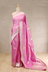 This Baby Pink Katan Banarasi Silk Saree with Gold and Silver Zari Border is a wedding saree and festive wear saree. Free Shipping Available!