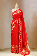 This Red Banarasi Silk Saree with Geometrical Zig-Zag Border is a wedding saree and festive wear saree. Free Shipping Available!
