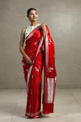 This Red Handloom Banarasi Satin Silk Saree with Silver And Gold Zari is a wedding saree and festive wear saree. Free Shipping Available!