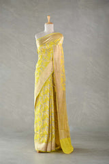 This Yellow Katan Silk Banarasi Saree with Floral Bird Motifs is a wedding saree and festive wear saree. Free Shipping Available!