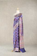 Purple Blue Banarasi Silk Saree with multicolor intricate patterns on a mannequin against a plain background