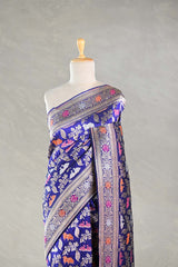Purple Blue Banarasi Silk Saree with multicolor intricate patterns on a mannequin against a plain background