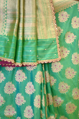 A sea green Banarasi silk saree with zari motifs on dummy