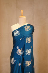 A blue Banarasi silk saree with zari motifs on dummy