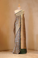A Green Brocade Banarasi Silk Saree on Dummy