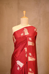 A red banarasi silk saree on dummy