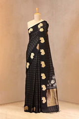 Black Puna Banarasi silk saree with gold zari checks, mayur motif border and Bandhani Pichwai floral pallu