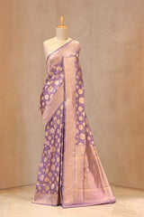 Close up of Lavender Banarasi Katan Silk Saree showing gold zari woven polka butas on the body and gold zari border.