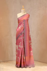 Close up of rose pink Semi Silk Saree showing digital floral prints across the body and plain shaded border with zari stripes on the pallu.