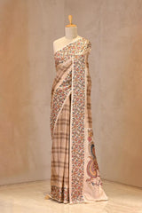 Close up of Beige Semi-Silk Saree showing shaded checkered body, scattered water gold zari butis, and Kalamkari printed border.