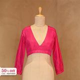 Pink blouse on a mannequin with 50% offer label