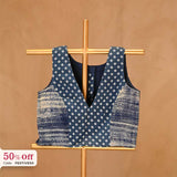 blue printed top blouse on a mannequin with a beige background, with promotional text of 50% off