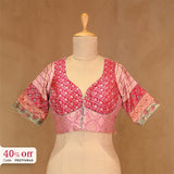 A Pink embroidered blouse on a mannequin with a promotional text Diwali sale offer on blouses up to 50%