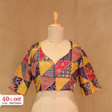 A colorful designer blouse on a mannequin with a promotional text Diwali sale offer on blouses up to 50%