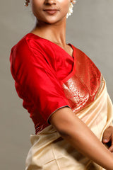 Woman wearing a red and beige traditional outfit with a plain background