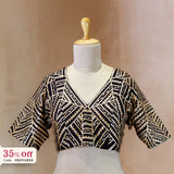 Black and gold patterned blouse on a mannequin with a promotional text Diwali sale offer on blouses up to 50%