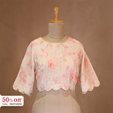 Floral blouse on a mannequin with a promotional text Diwali sale offer on blouses up to 50%