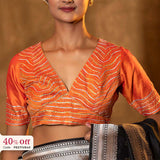 Orange bridal blouse with a promotional text Diwali sale offer on blouses up to 50%
