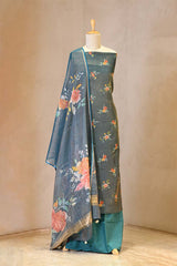 Traditional outfit with floral design on a mannequin against a neutral background