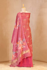 Pink saree with floral patterns on a mannequin against a beige background