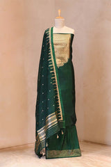 A Dummy Wearing Bottle Green Banarasi Suit Set showing Gold Zari Yoke and Organza Dupatta