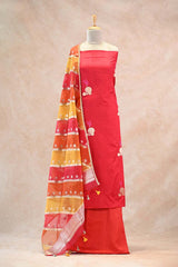 Close up of gold zari and resham woven floral buta on red Dupion silk kurta with a multi-colored Rangkat organza dupatta featuring slanting zari stripes.