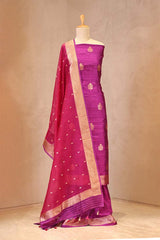 Purple saree with gold border on a mannequin against a beige background