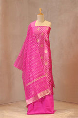 Rani pink raw mango silk suit with zari jaal work and organza dupatta