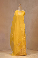 Yellow satin silk suit with bird motif neckline and organza dupatta