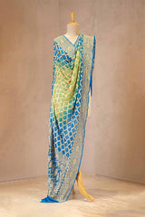 Blue and green dupatta with intricate patterns on a mannequin against a beige background