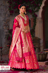 A bride in a traditional pink and golden Lehenga with a promotional text sale offer on Lehenga up to 50%