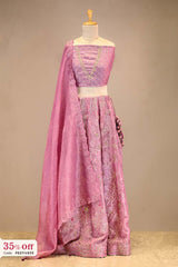 Pink embroidered Lehenga with a dupatta on a mannequin with a promotional text sale offer on Lehenga up to 50%