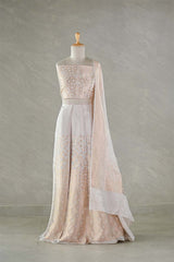 An Elegant Bridal lehenga gown with floral patterns on a mannequin