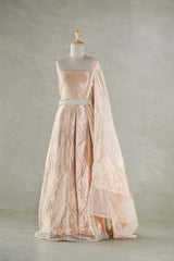 A golden bridal lehenga gown on a mannequin