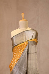 Yellow Chiniya Banarasi Silk Saree with Bandhni Buti & Silver Zari Border