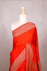 Reddish Orange Handloom Crepe Saree with Shikargah Zari Work