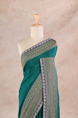 Bottle Green Crepe Silk Saree with Antique Zari Floral Border and Lace