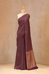 Close up of Wine Crepe Banarasi Khaddi Silk Saree showing antique gold zari stripes running across the body and a coordinating gold zari border.