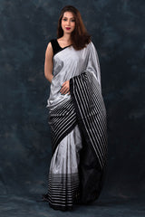 This Grey & Black Striped Handwoven Satin Silk Saree is a wedding saree and festive wear saree. Free Shipping Available!