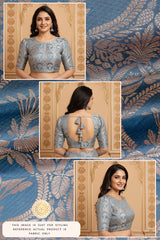 Woman wearing a blue blouse like Aishwarya Rai saree design with intricate patterns on a matching fabric background