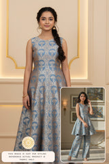 Aaradhya Bachchan wearing a blue Banarasi fabric made dress in Anant Ambani wedding, standing in an elegant interior setting.